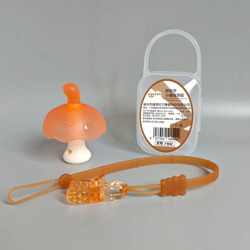 Small mushroom-shaped silicone chew gum with transparent chain attachment in pink colour