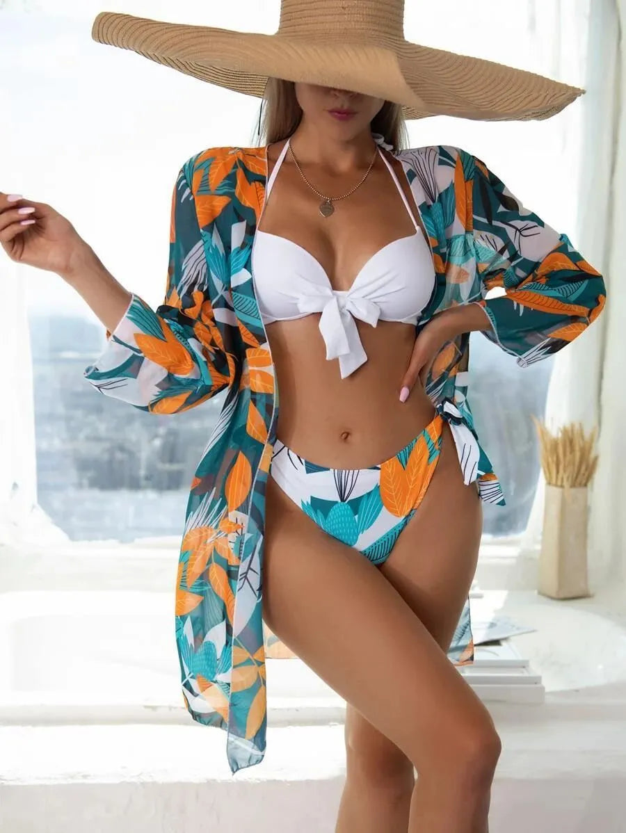 Women's three-piece polyester bikini swimsuit set with mesh detail in a conservative cut