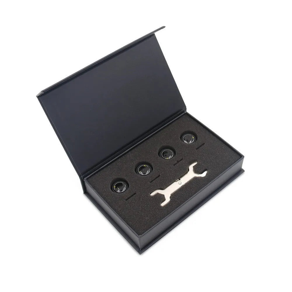 Black automotive tyre pressure monitoring system with four Bluetooth sensors and installation tools