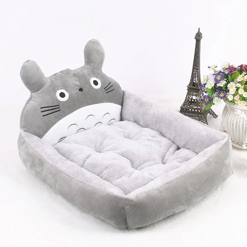 Blue cartoon-style sofa pet bed with a removable padded cushion for a small dog or cat.