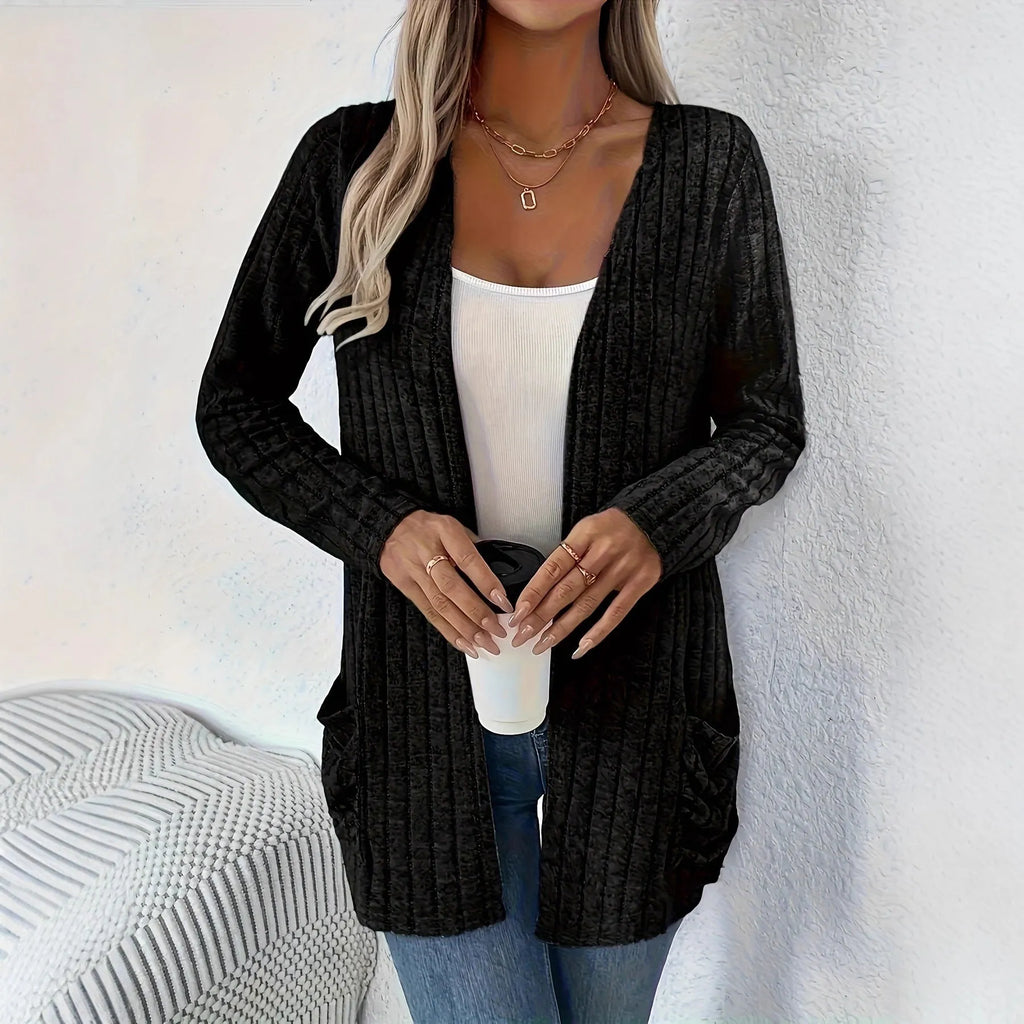 Solid colour long sleeve cardigan with front pockets in a loose fit, shown in grey.