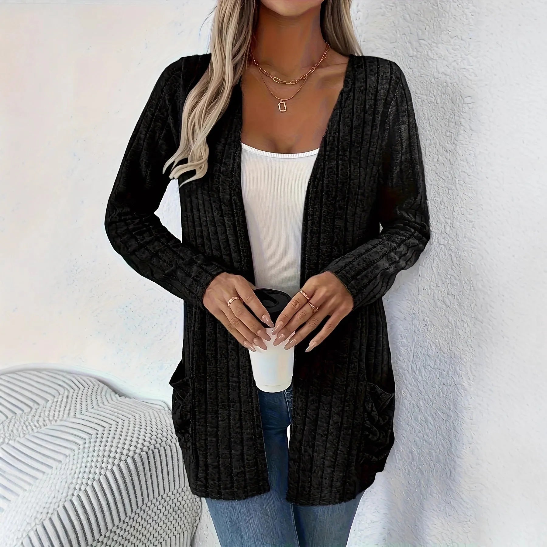 Solid colour long sleeve cardigan with front pockets in a loose fit, shown in grey.