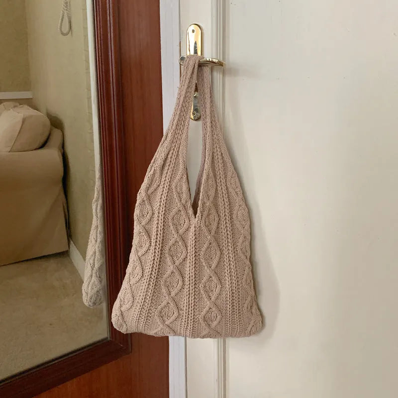 Knitted wool yarn shoulder tote bag with hollow crochet design in solid colour