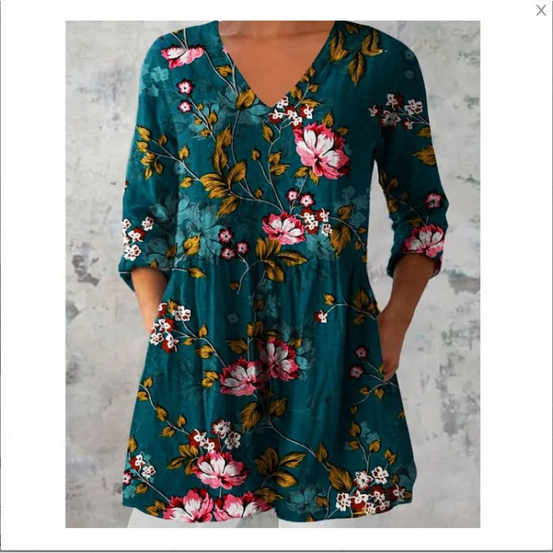 Women's printed loose wave dress with wide waist and three-quarter sleeves in a floral pattern.