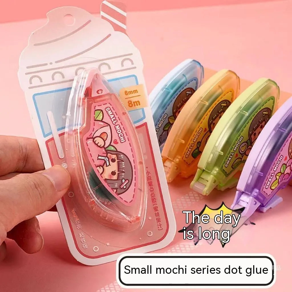 Colourful dotting glue dots on a card for craft and stationery adhesion
