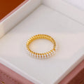 Geometric open mouth ring with electroplated gold finish and round pearl elements