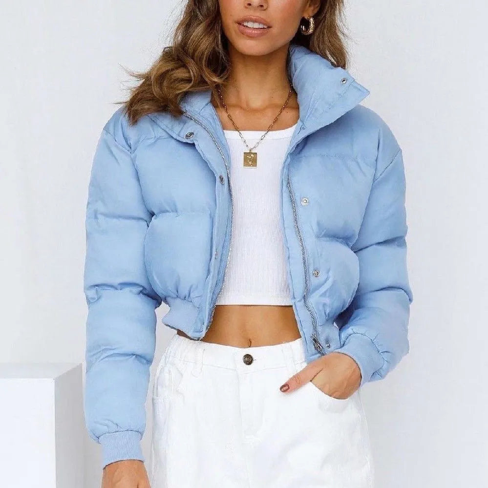 Women's loose blue polyester jacket with long sleeves shown front view