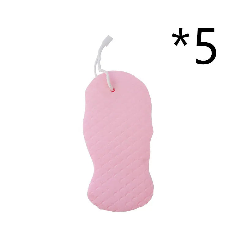 White 3D fish scale pattern bath sponge ball on a bathroom surface