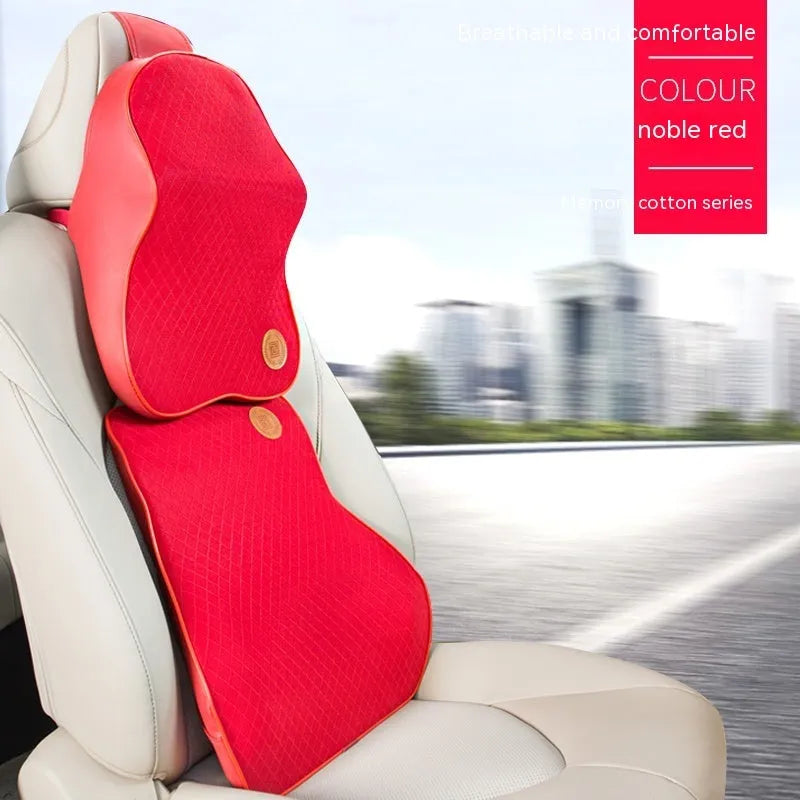 Black and brown memory foam car headrest and lumbar support pillows on a car seat.