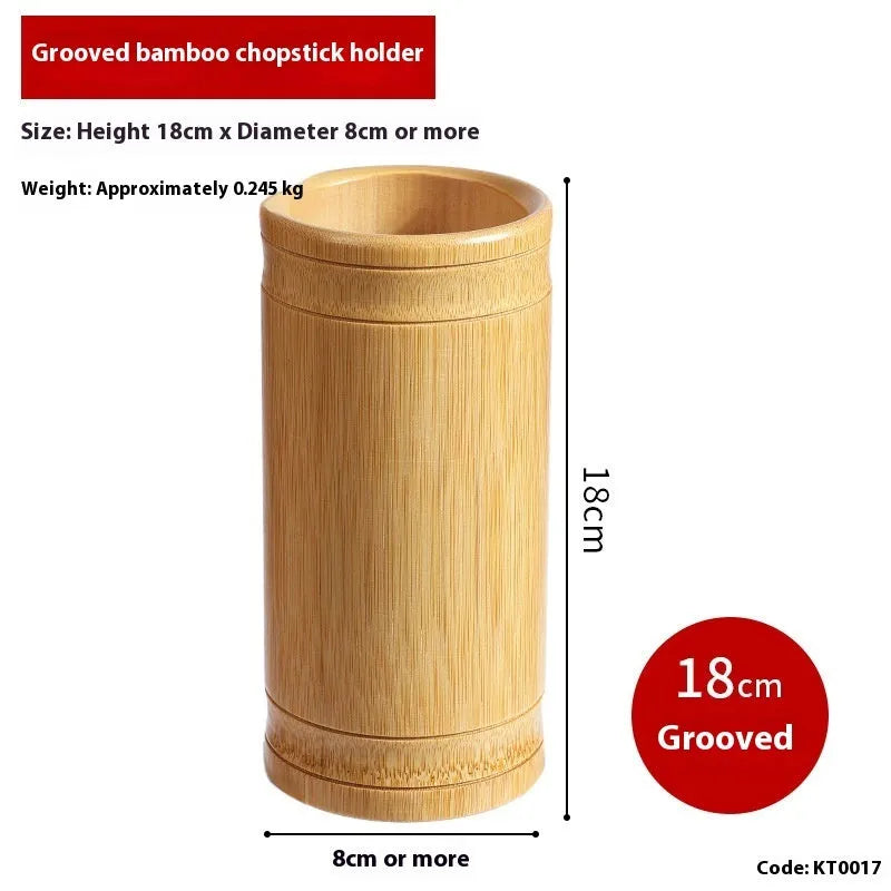 Wild bamboo chopsticks holder tube on a kitchen countertop.