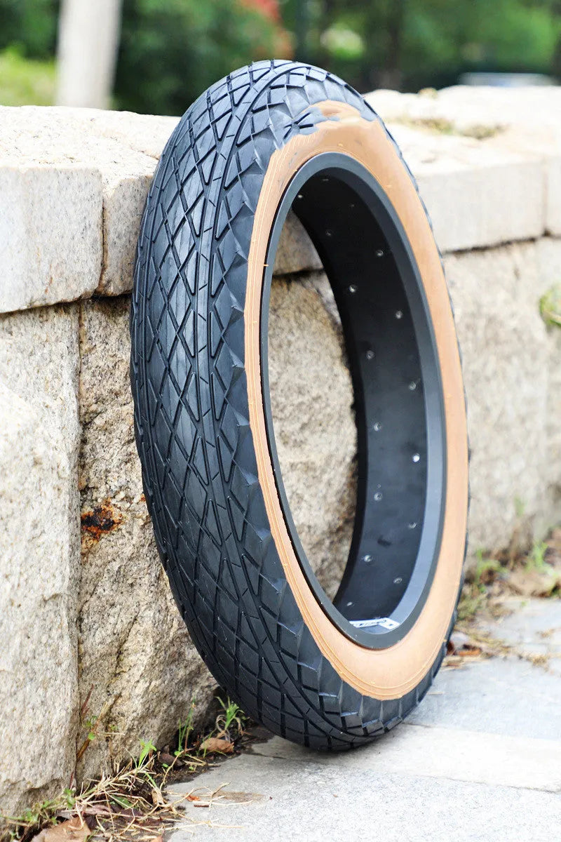 Brown rubber tyre for snowmobiles and electric beach cars measuring 20x4.0 inches