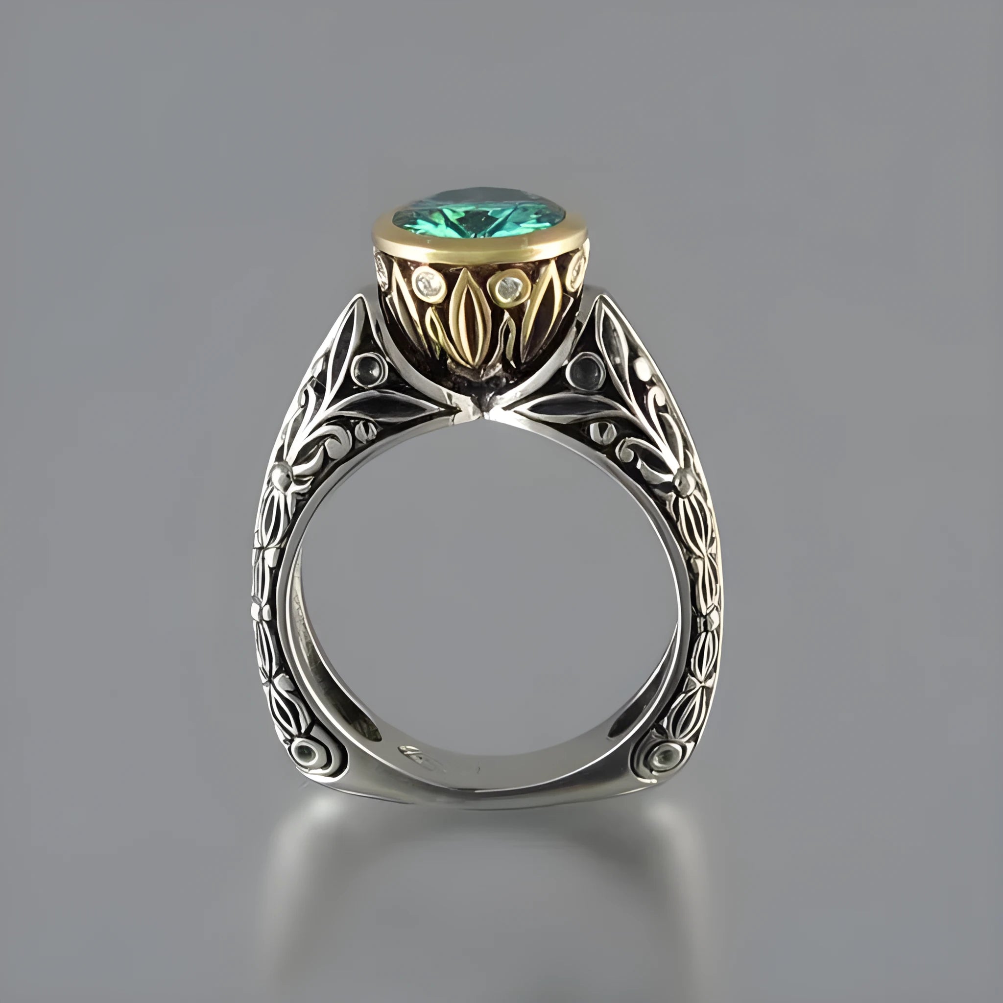 Gold-plated flower-shaped ring with vintage gemstone details in green silver colour