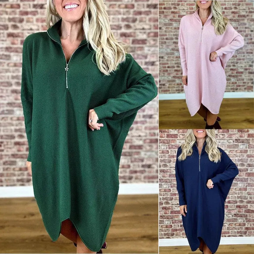 Women's solid colour loose fit knitted dress with raglan sleeves on a model.