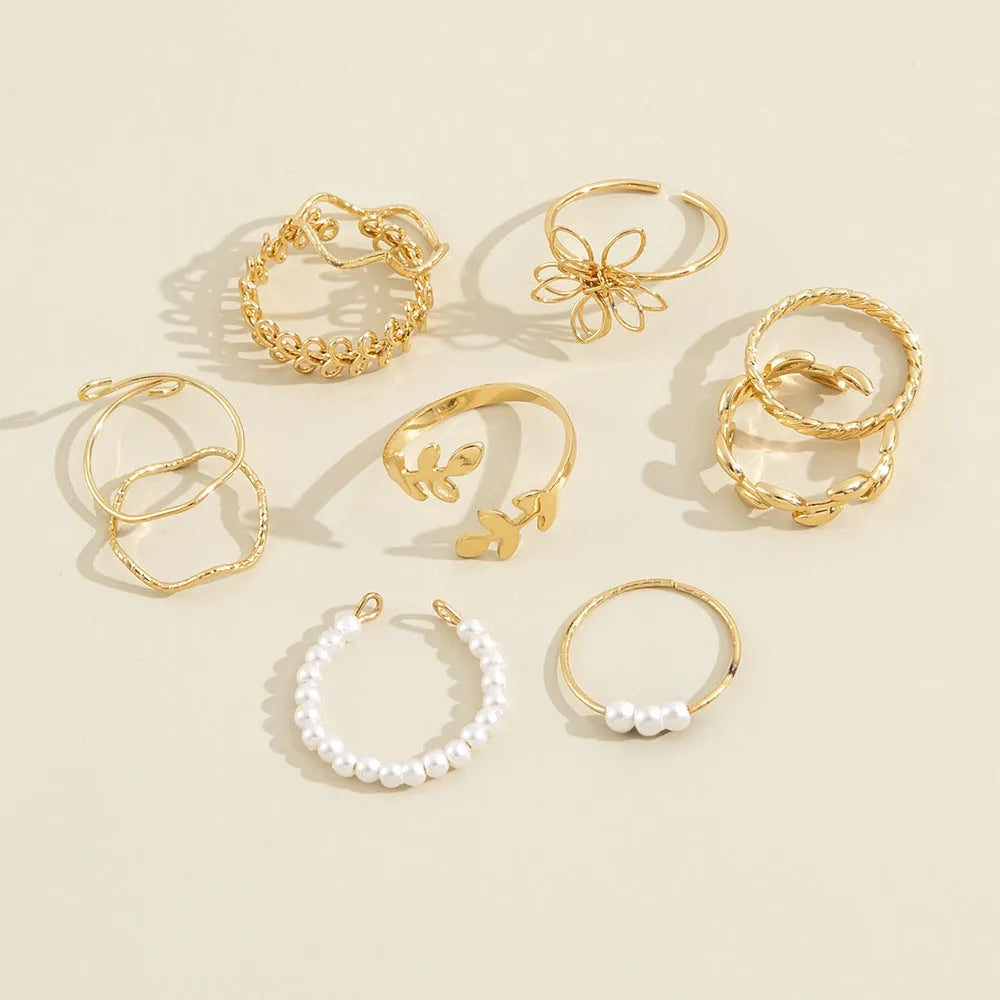 Openwork flower design ring set in glossy gold alloy for women