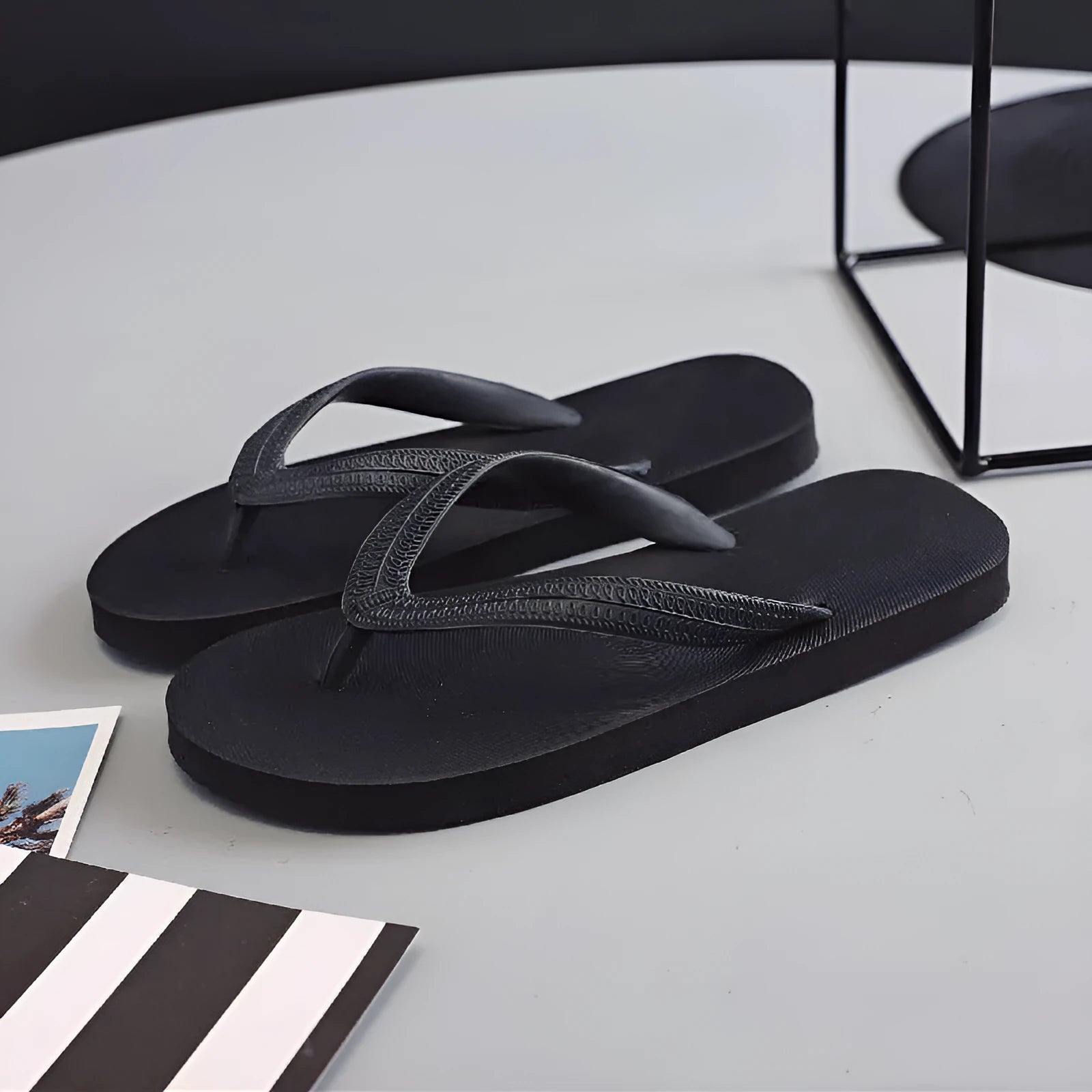 Colour options of rubber beach flip-flops with fish brand label, showing non-slip sole.
