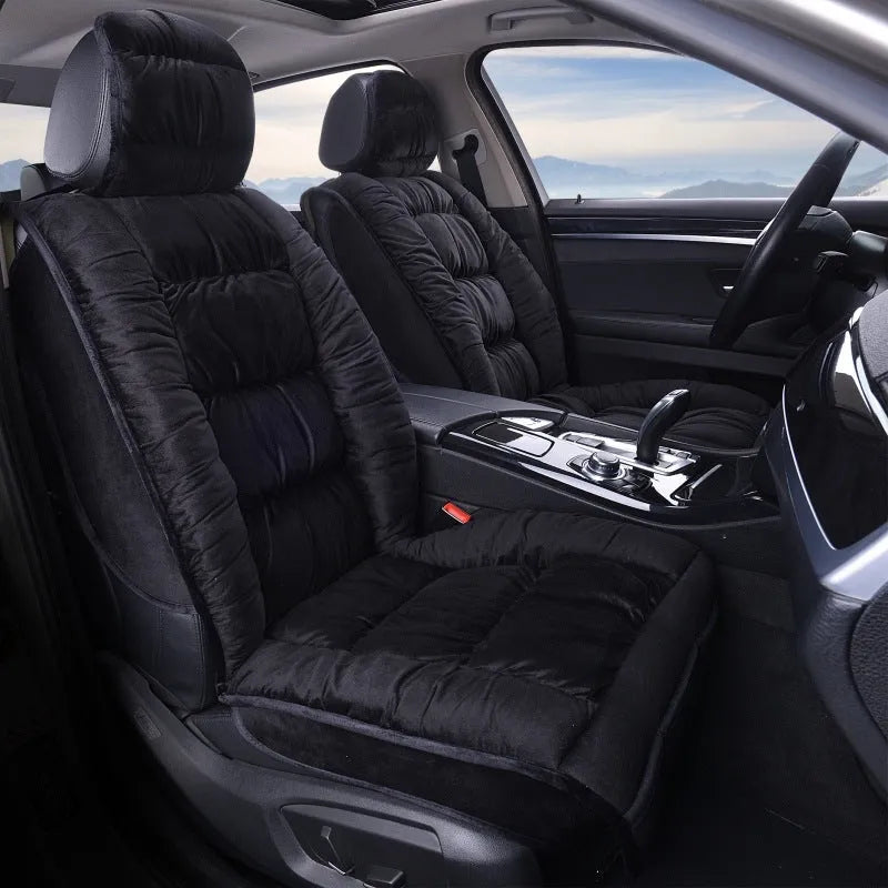 Short plush car seat cushion in charcoal grey on vehicle seat