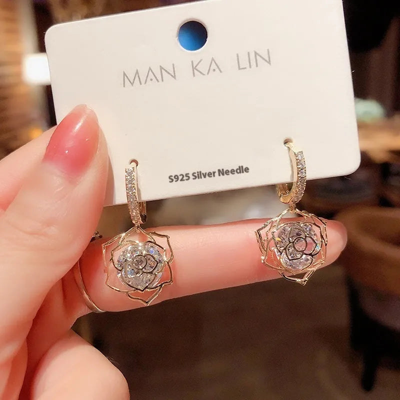Geometric copper earrings with zircon stones in electroplated finish