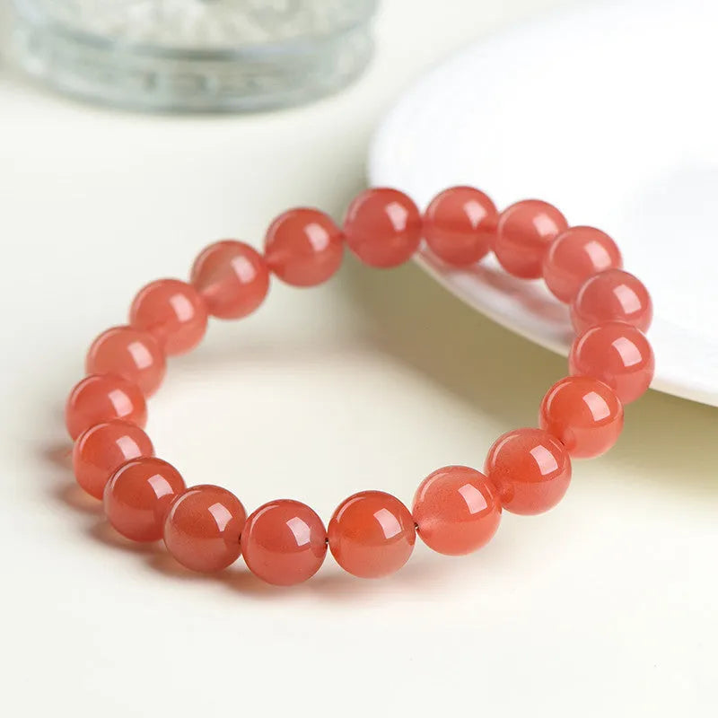 Natural polished cherry red agate scattered beads bracelet on a wrist, showing single circle and three circle size options.