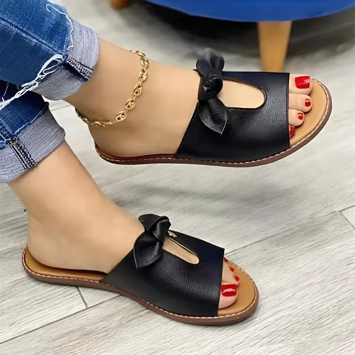 Ladies casual sandals with a bow detail and fish mouth slipper style in black, pink, or gold.