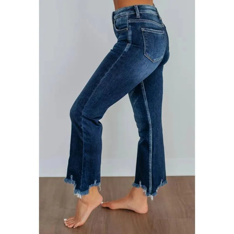 Solid colour women's denim jeans in dark blue and light blue washes, showing hand-worn detail.