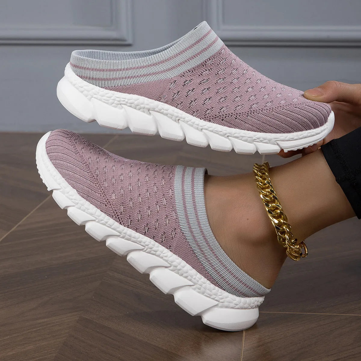Women's striped Flyknit slipper shoes in black, pink, or purple with hollowed-out sewing line details