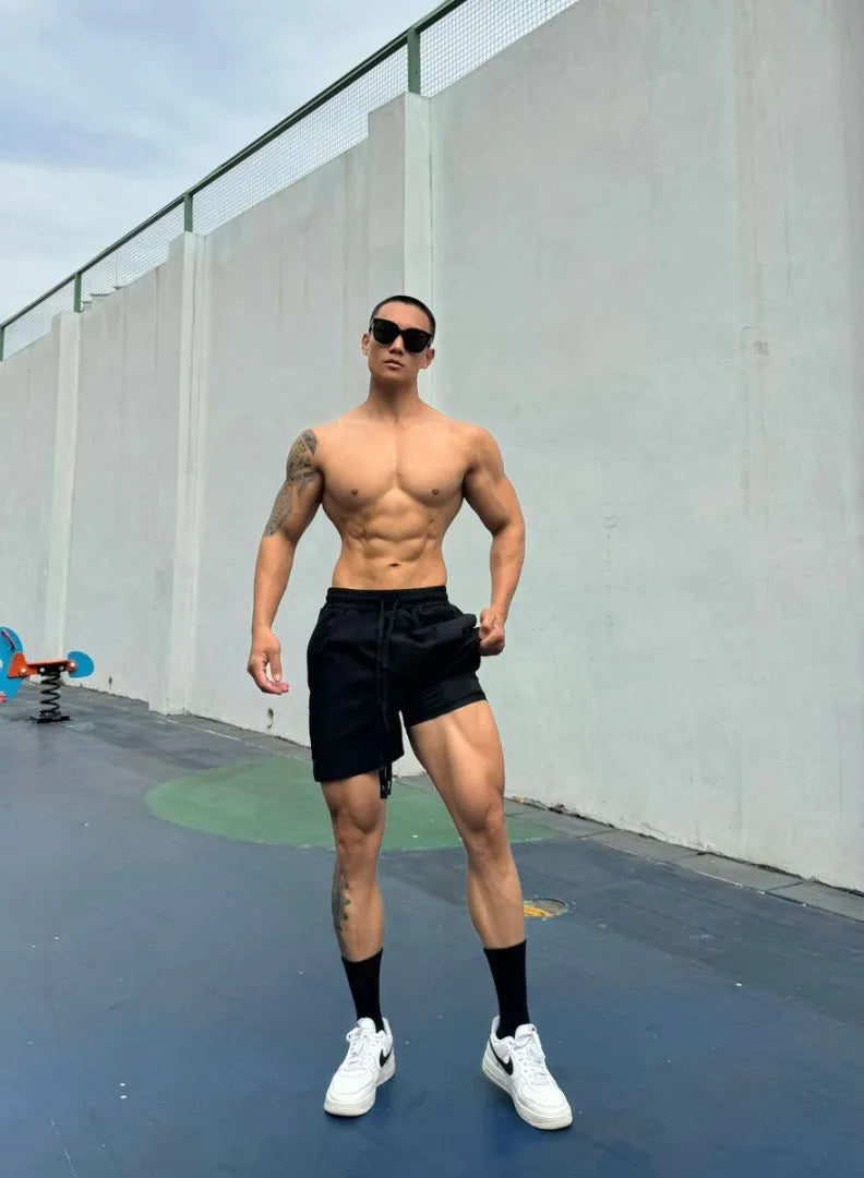 Man wearing grey ice silk quick-drying double-layer quarter shorts on a casual day out.