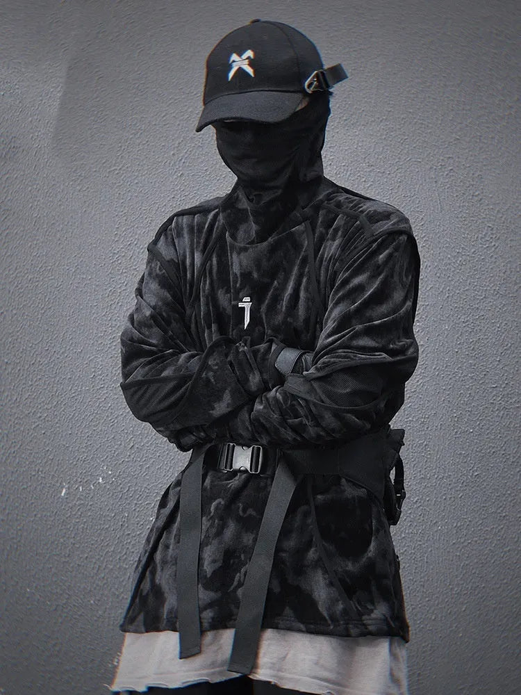 Black and grey tie dye printed men's turtleneck sweater with drop shoulders on a model.