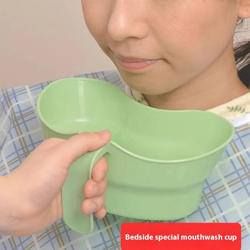 Green plastic nursing gargle cup with angled spout for bedridden patient mouthwash routines