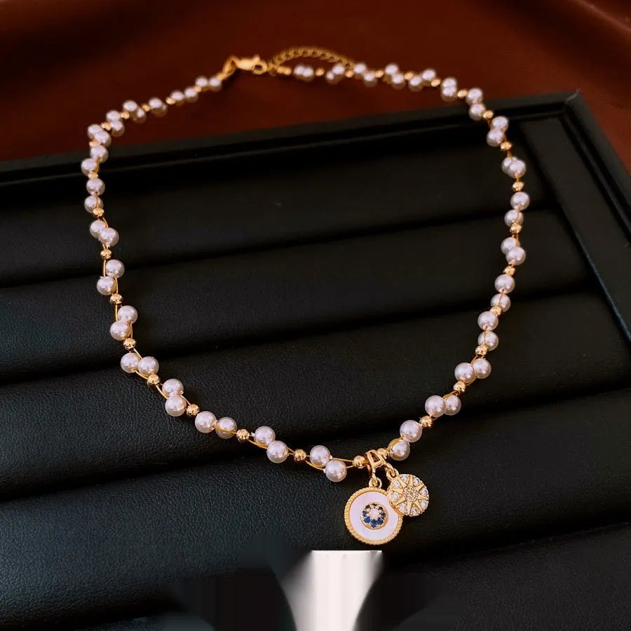 Gold electroplated zircon and imitation pearl pendant necklace with adjustable clavicle chain
