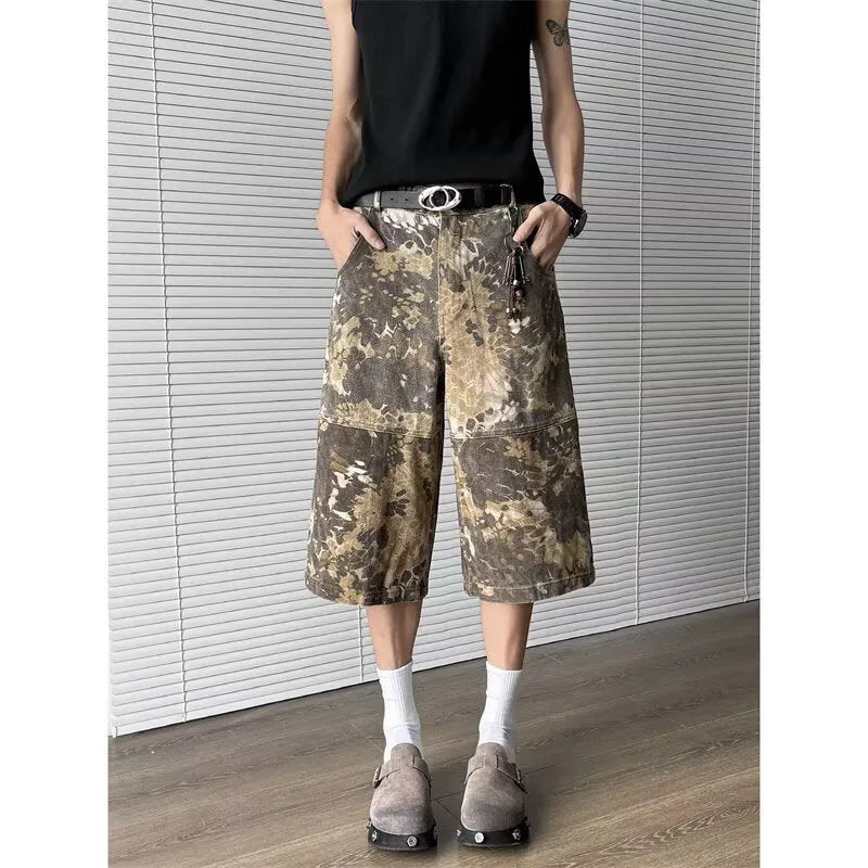 Yellow snake pattern camouflage cropped jeans on hanger showing tooling detail