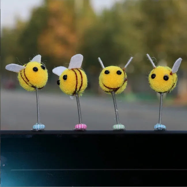 Swing spring bee car decoration made from a fur ball, measuring 3cm by 3cm.