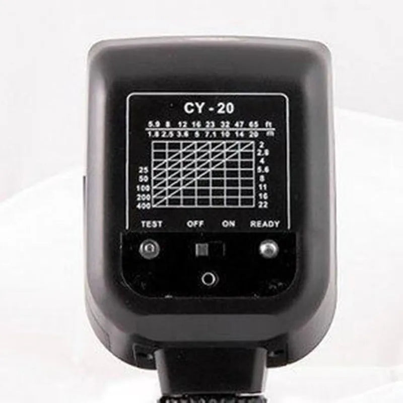 Silver top-mount SLR camera flash accessory with head tilted up, showing hot shoe mount and battery compartment.
