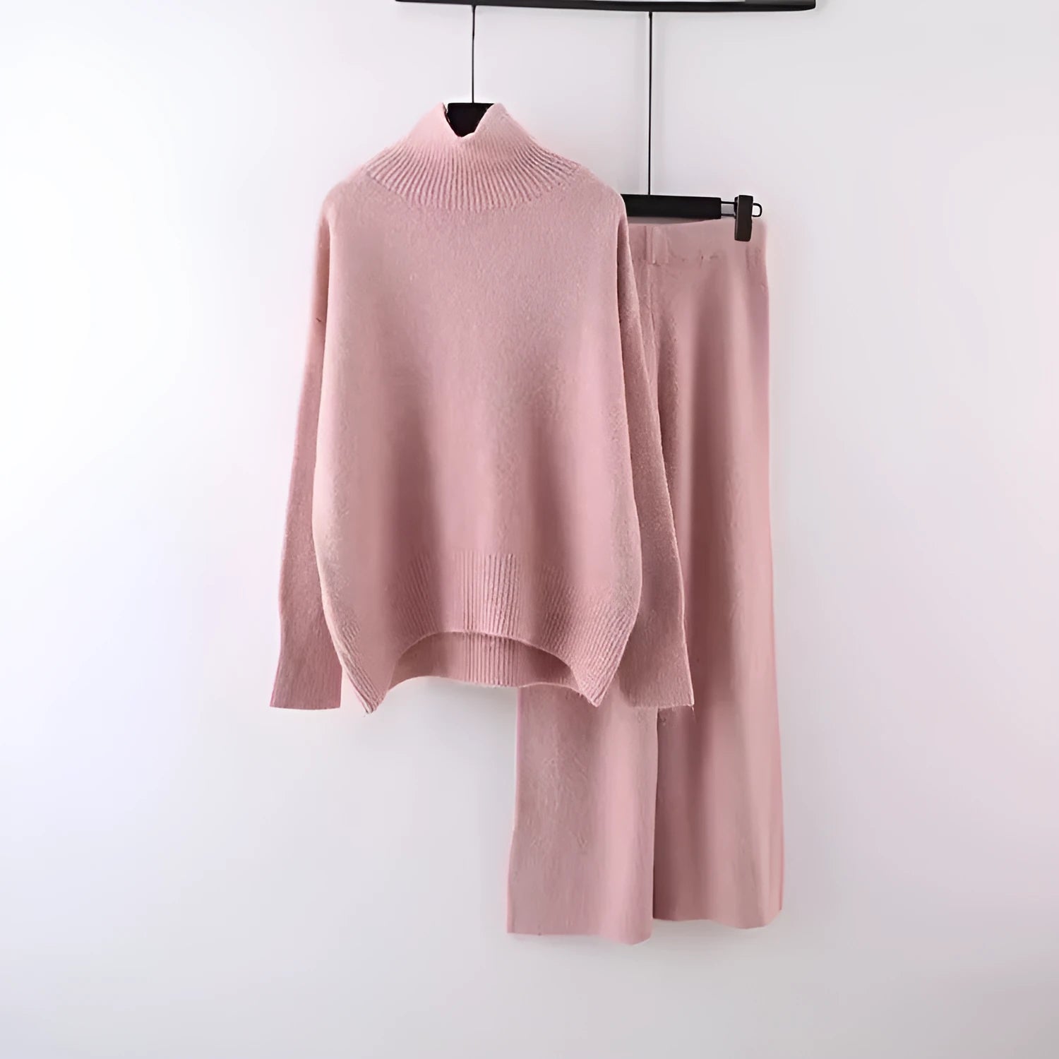 Women's casual two-piece set featuring a long sleeve sweater and wide leg trousers in a solid colour.