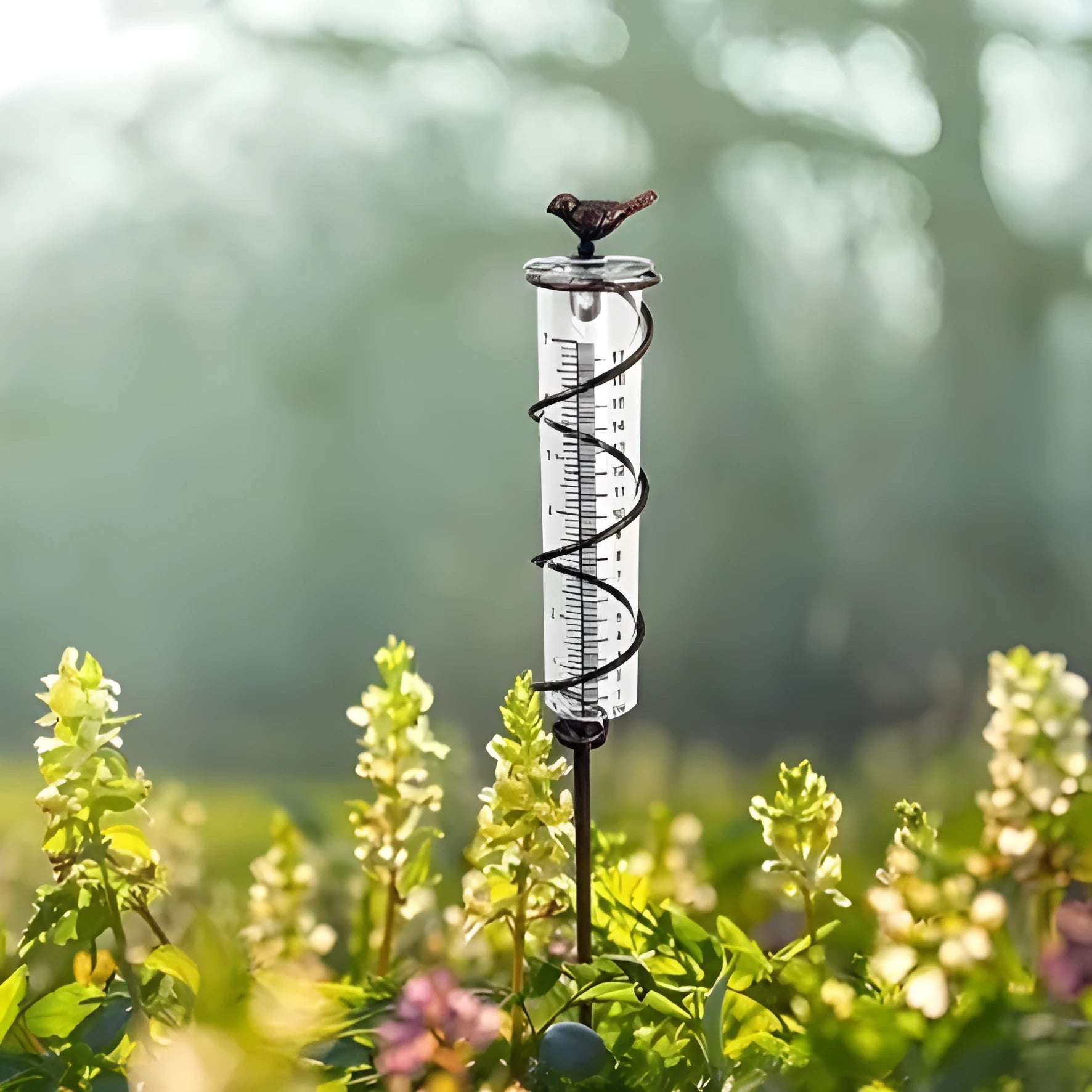 Traditional cast iron stand with bird-shaped glass rain gauge for garden precipitation measurement