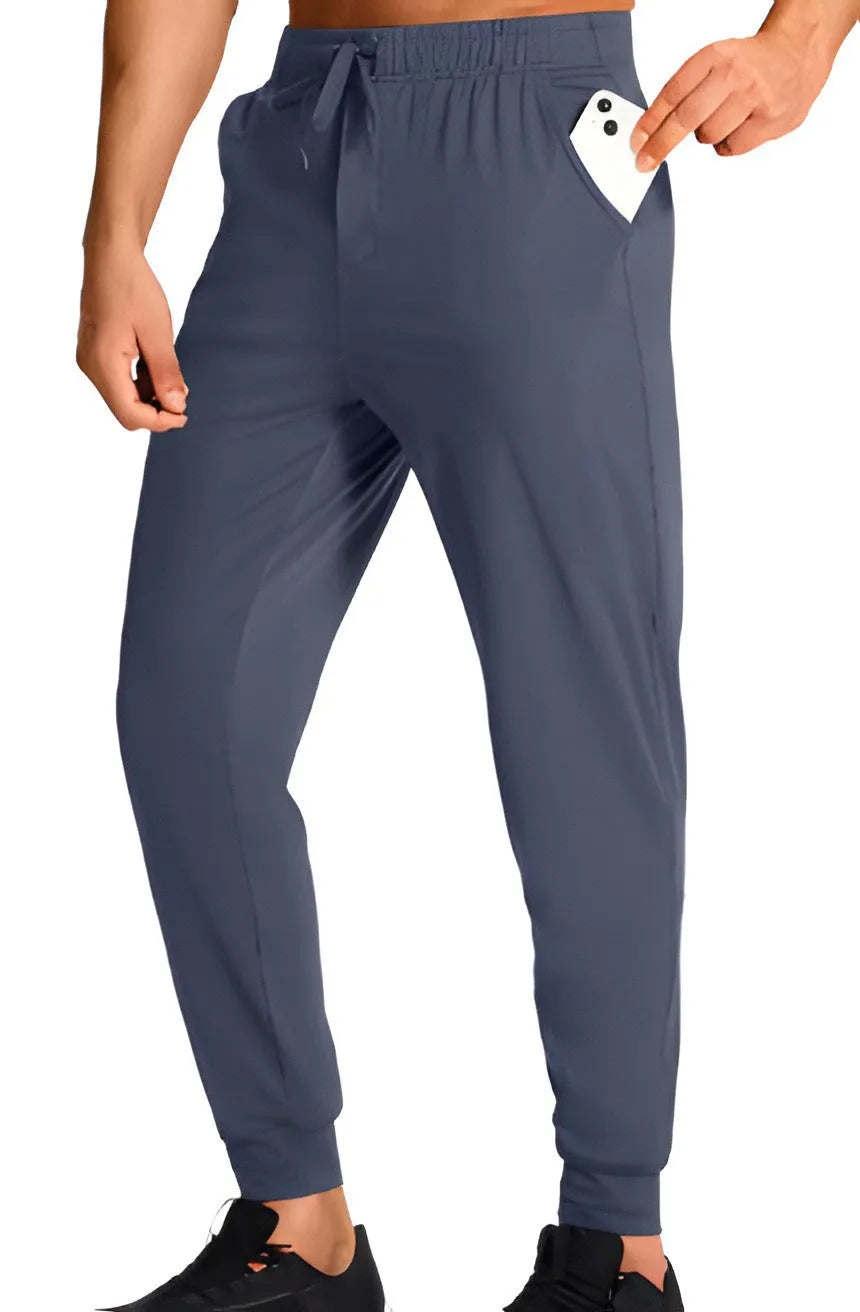 Men's loose-fit straight-leg casual trousers in a solid colour, made from polyester fabric.