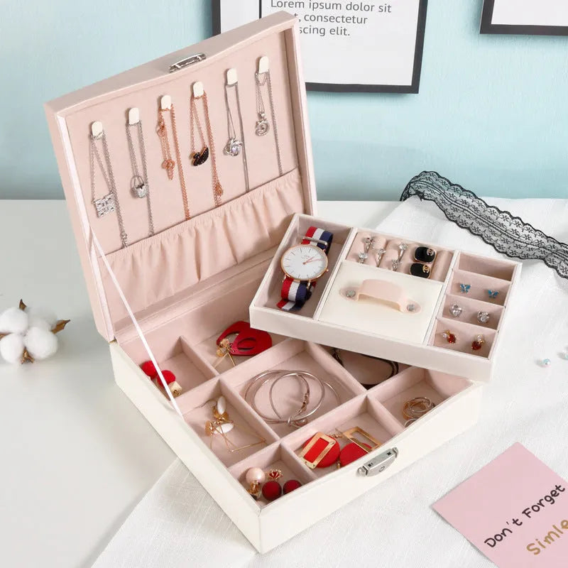 Red and white PU leather jewellery storage box with multiple compartments for necklaces and rings