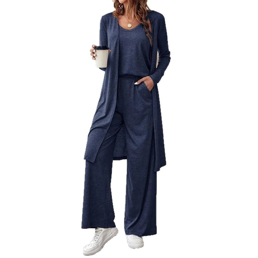 Blue women's three-piece suit set with sling top, long cardigan and trousers on hanger