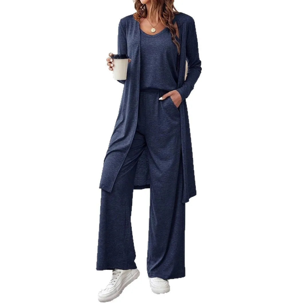 Blue women's three-piece suit set with sling top, long cardigan and trousers on hanger
