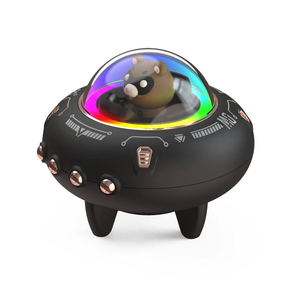 Creative UFO mini Bluetooth speaker in black with round design, showing charging port and speaker grille
