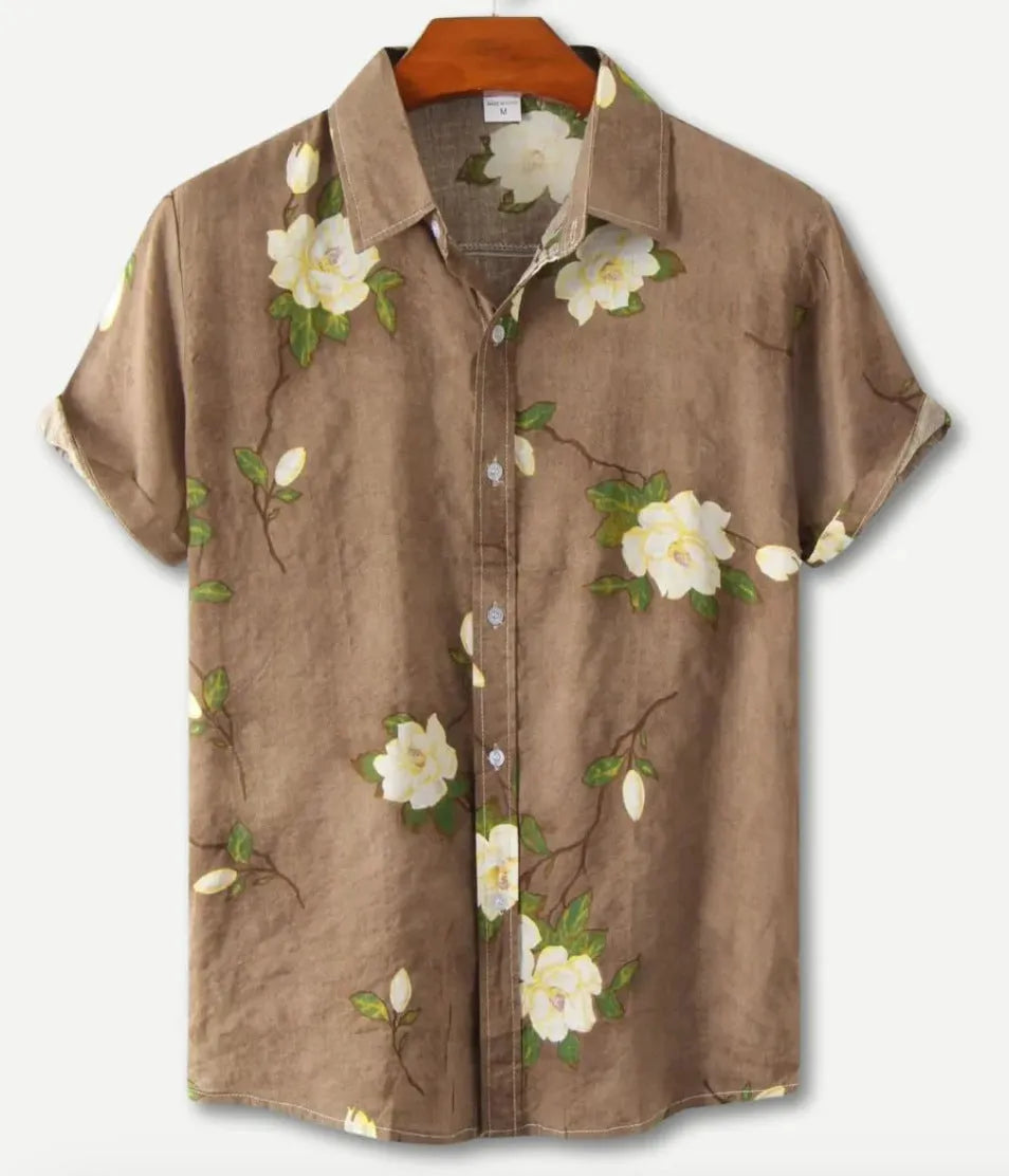 Man wearing a short sleeve Hawaiian floral print shirt with a lapel neckline, showcasing the digital print pattern.