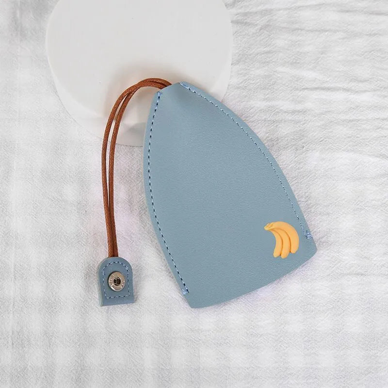 Cartoon design pull-out car key case made from soft PU leather, showing approximate size.