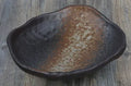 Creative Japanese style irregular shaped porcelain sashimi bowl with floral decoration and a small sauce dish