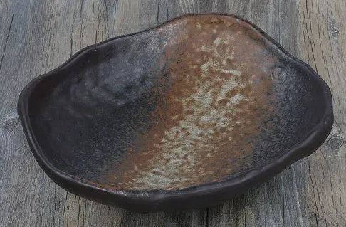 Creative Japanese style irregular shaped porcelain sashimi bowl with floral decoration and a small sauce dish