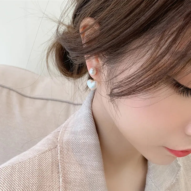 Women's heart-shaped pearl stud earrings with alloy inlaid gems and an electroplated finish.