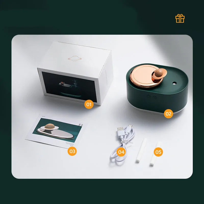 Rotating planet desktop humidifier with night light in green colour showing USB charging port and water tank