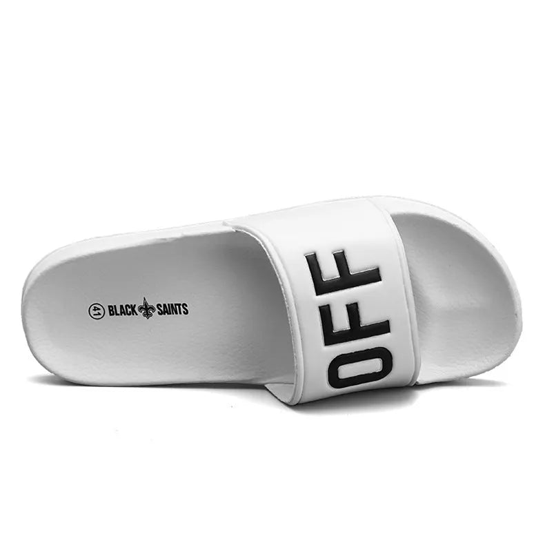 Men's black open-toe slippers with rubber soles showing personalised detail