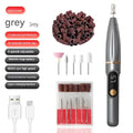Compact electric nail file with LCD display, USB charging cable, and three spare sanding bands