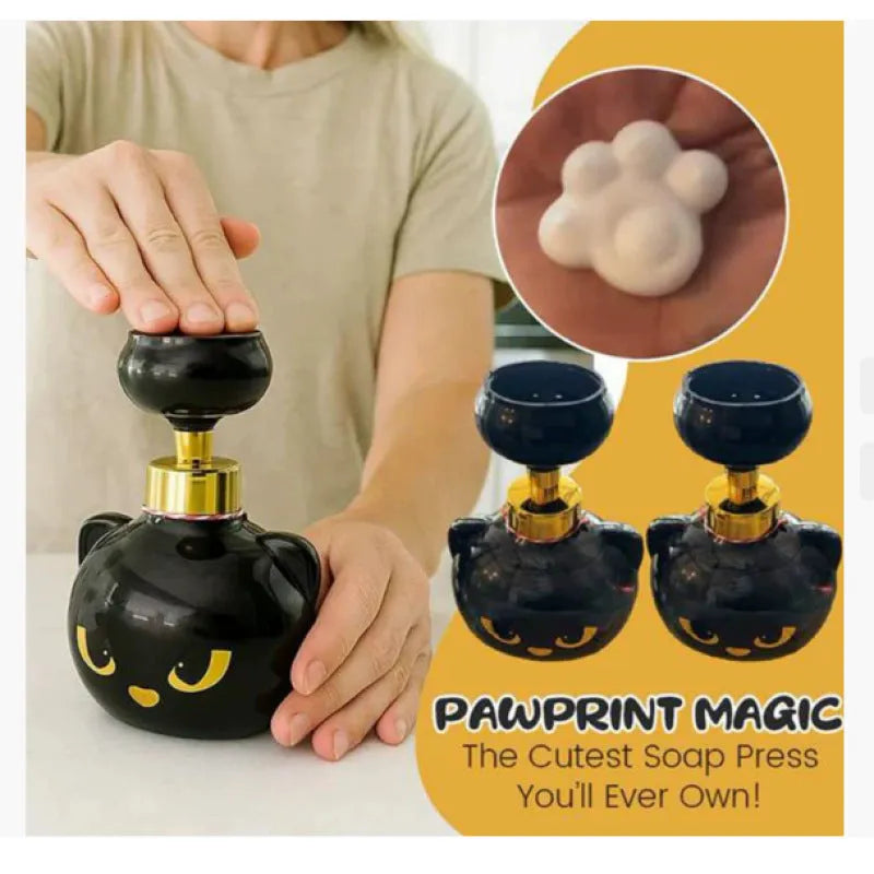 Black cartoon cat-shaped automatic foam soap dispenser on a countertop.