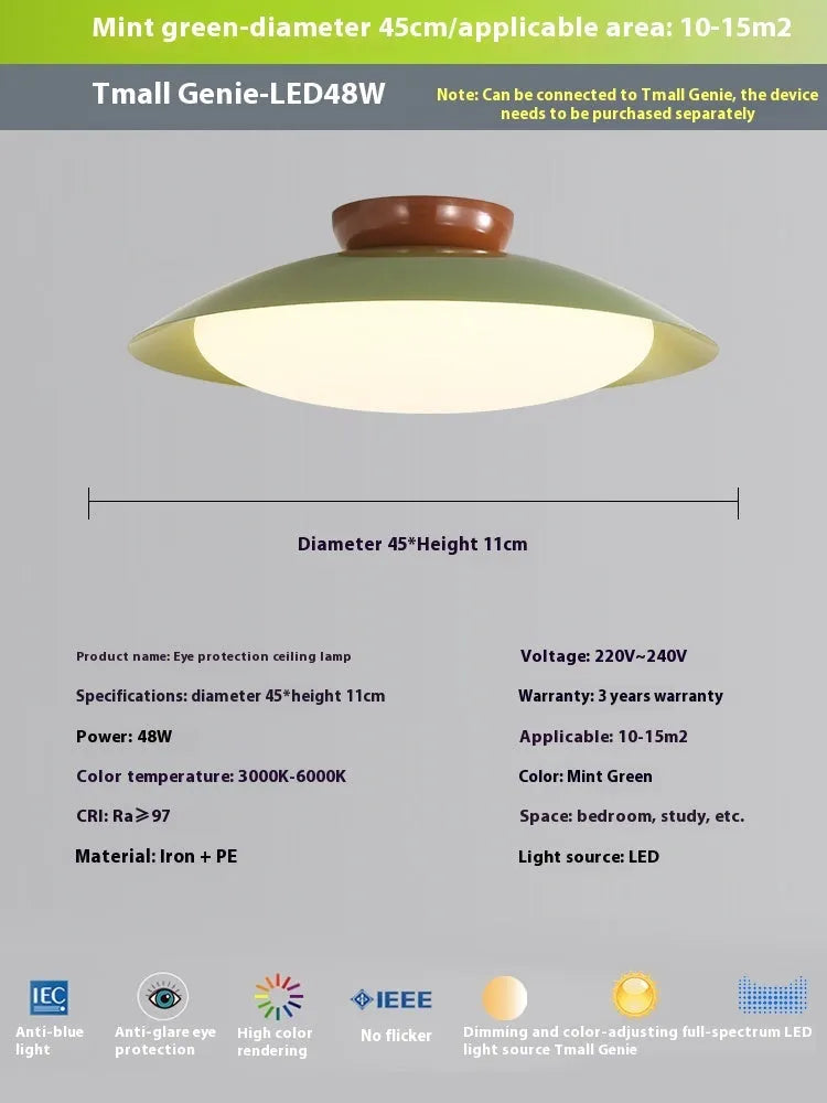 Modern cream-style flying saucer shaped ceiling lamp in a bedroom setting.