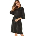 Black A-line dress with elastic waistband and cuffs, mid-length design for professional wear